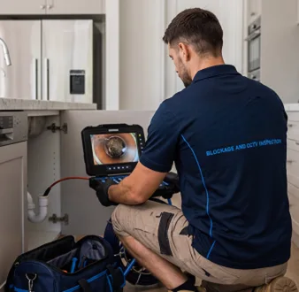 Clearing a blocked sink at a Pyrmont property